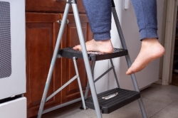 person on stepstool